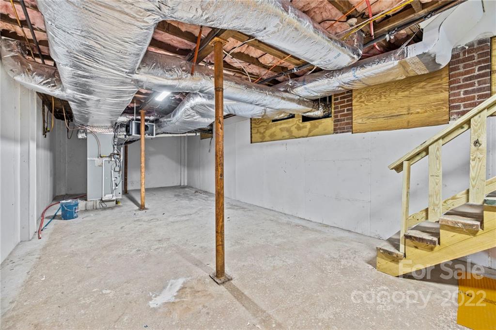 6000 Hickory Grove Road Charlotte, NC 28215 - Photo 40 of 40 a view of a garage with wooden floors