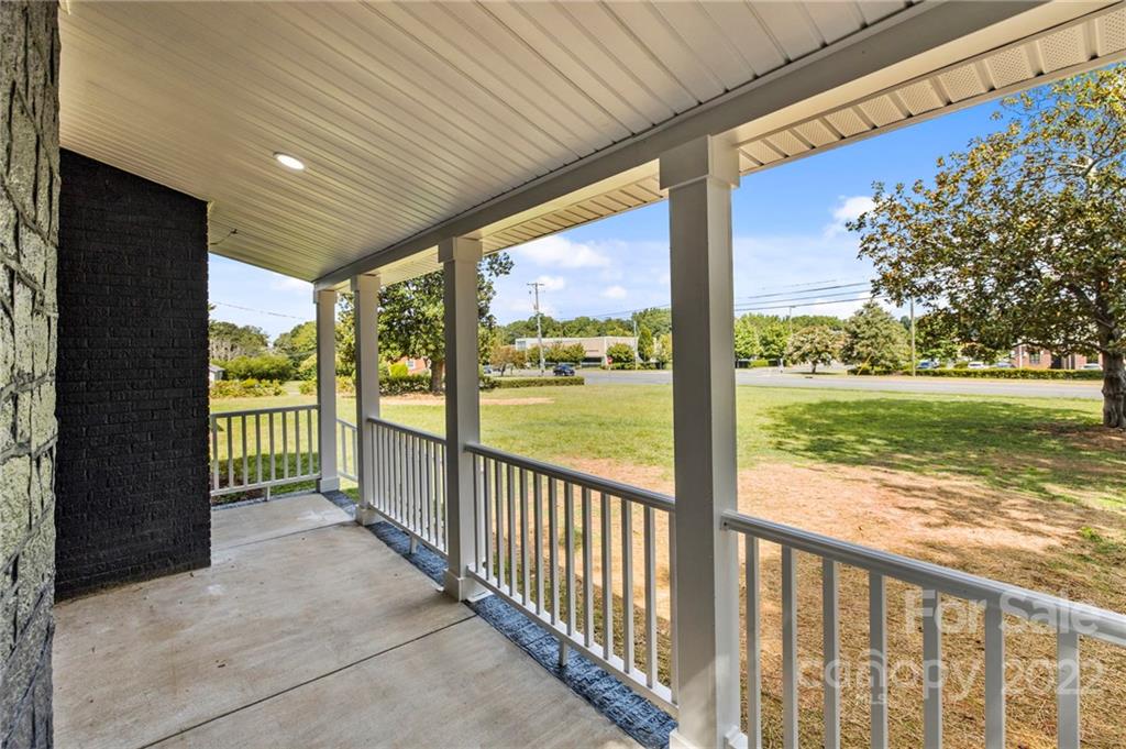 6000 Hickory Grove Road Charlotte, NC 28215 - Photo 6 of 40 a view of a porch with a big yard