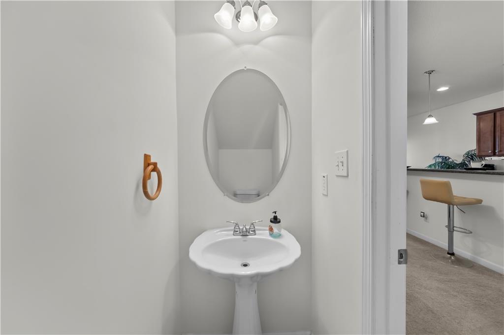 6120 Capitol Knoll Fairburn, GA 30213 - Photo 13 of 28 a bathroom with a sink and a mirror