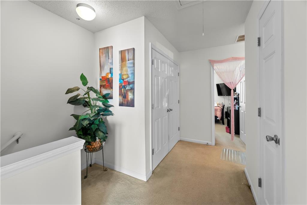 6120 Capitol Knoll Fairburn, GA 30213 - Photo 14 of 28 a view of a hallway and interior of a house