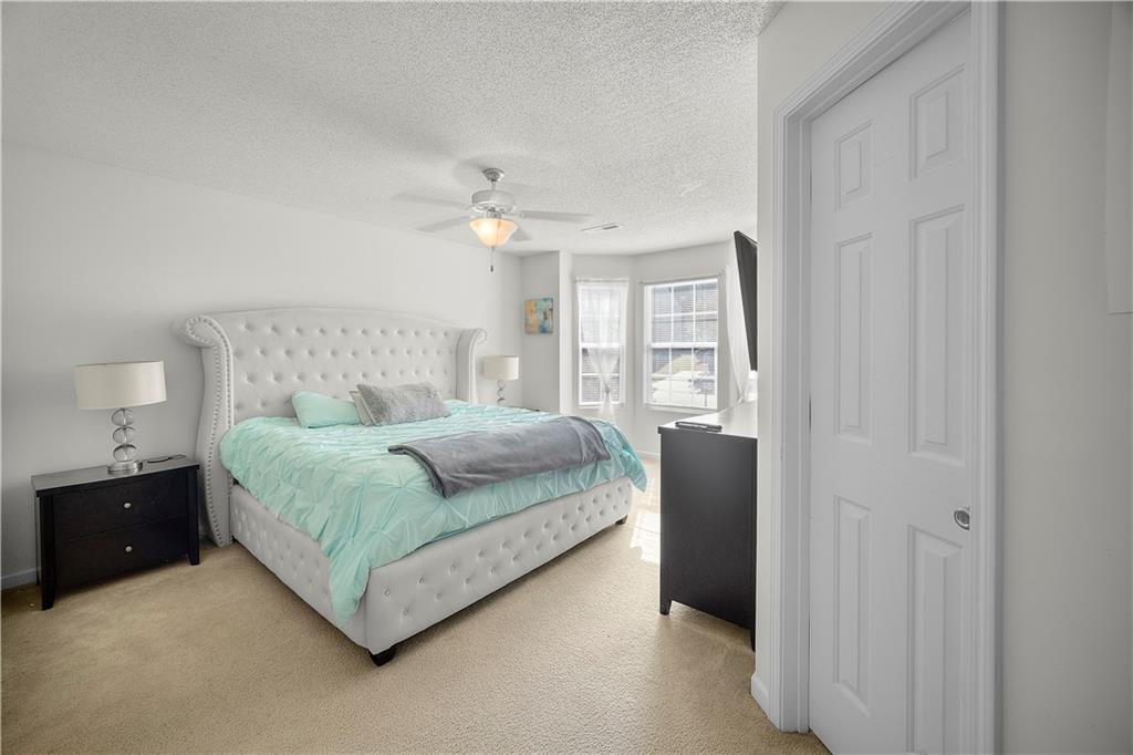 6120 Capitol Knoll Fairburn, GA 30213 - Photo 15 of 28 a bedroom with a bed and window