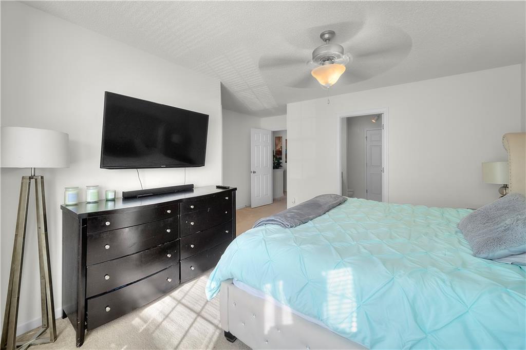 6120 Capitol Knoll Fairburn, GA 30213 - Photo 16 of 28 a bedroom with a bed and a flat screen tv