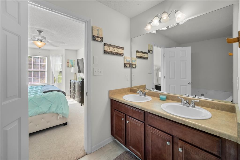 6120 Capitol Knoll Fairburn, GA 30213 - Photo 18 of 28 a en suite bathroom with a sink double vanity and a mirror