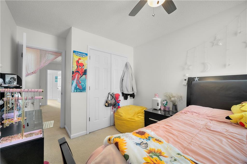 6120 Capitol Knoll Fairburn, GA 30213 - Photo 21 of 28 a bedroom with bed and window