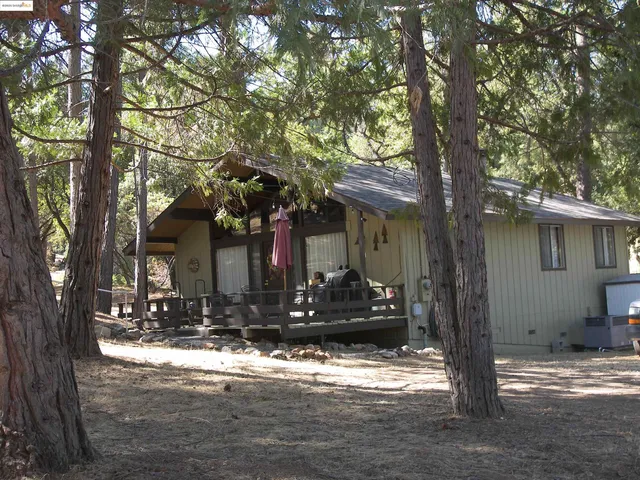 a kitchen with cabinets and a refrigerator