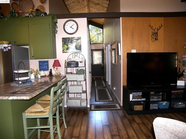 a bedroom with a bed and a mirror