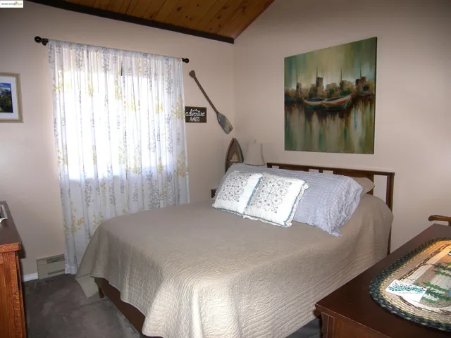 a living room with furniture and flat screen tv