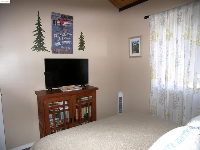 a view of hallway with furniture and a window