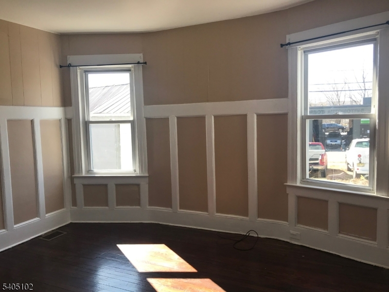 4 Fairview Avenue Somerville, NJ 08876 - Photo 5 of 11 a view of an empty room with wooden floor and a window