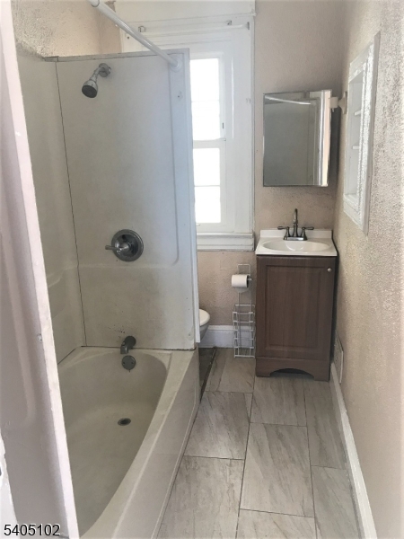 4 Fairview Avenue Somerville, NJ 08876 - Photo 9 of 11 a bathroom with a tub a sink and mirror