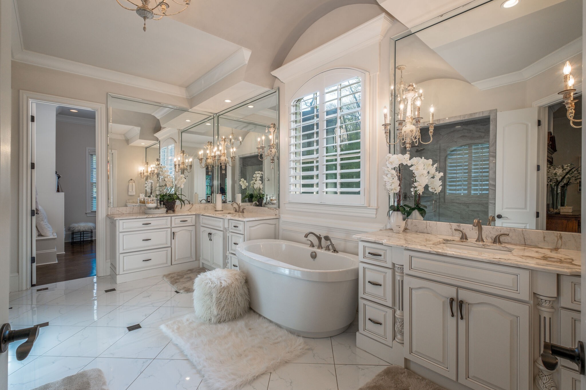 1813 Pace Haven Franklin, TN 37069 - Photo 23 of 49 a spacious bathroom with a double vanity sink a large mirror and a bathtub