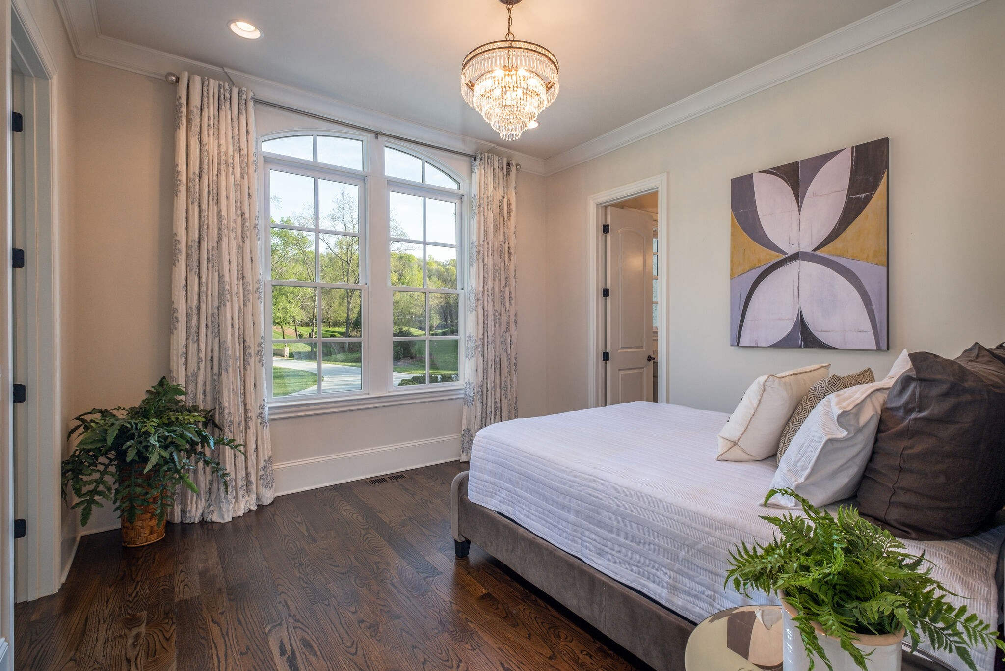 1813 Pace Haven Franklin, TN 37069 - Photo 25 of 49 a bedroom with a bed and a chandelier