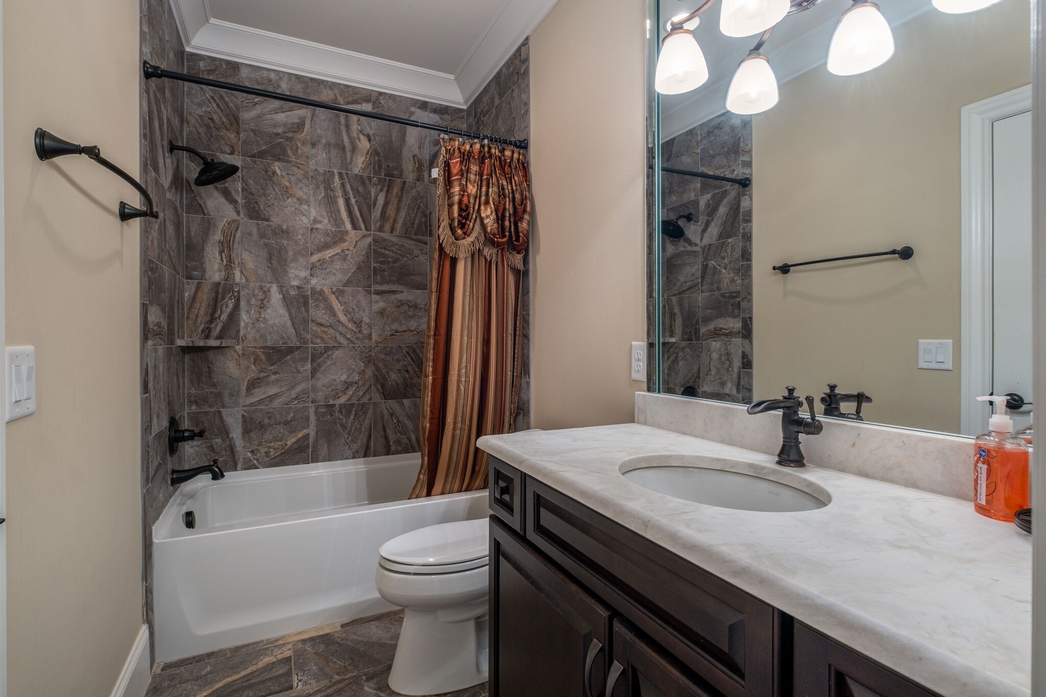 1813 Pace Haven Franklin, TN 37069 - Photo 35 of 49 a bathroom with a sink a toilet and a bathtub