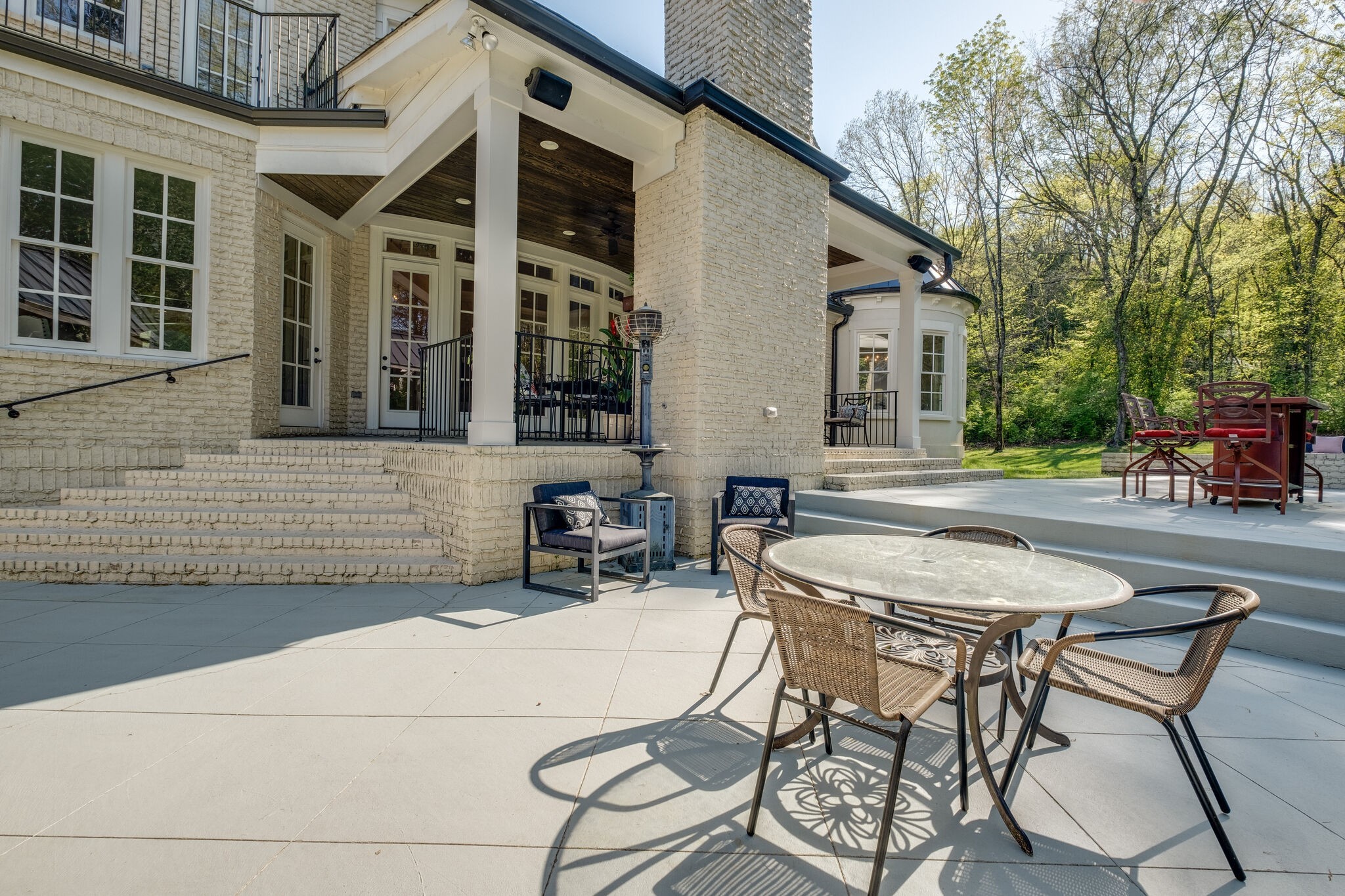 1813 Pace Haven Franklin, TN 37069 - Photo 44 of 49 a patio with a table and chairs and potted plants