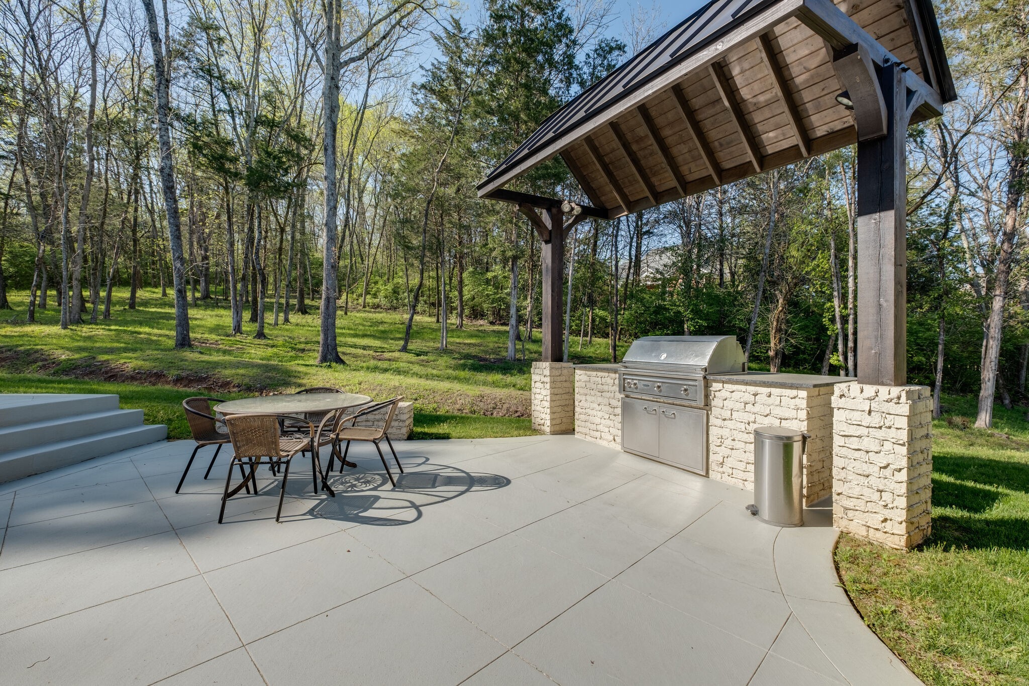 1813 Pace Haven Franklin, TN 37069 - Photo 45 of 49 a view of a patio with a table chairs and a yard
