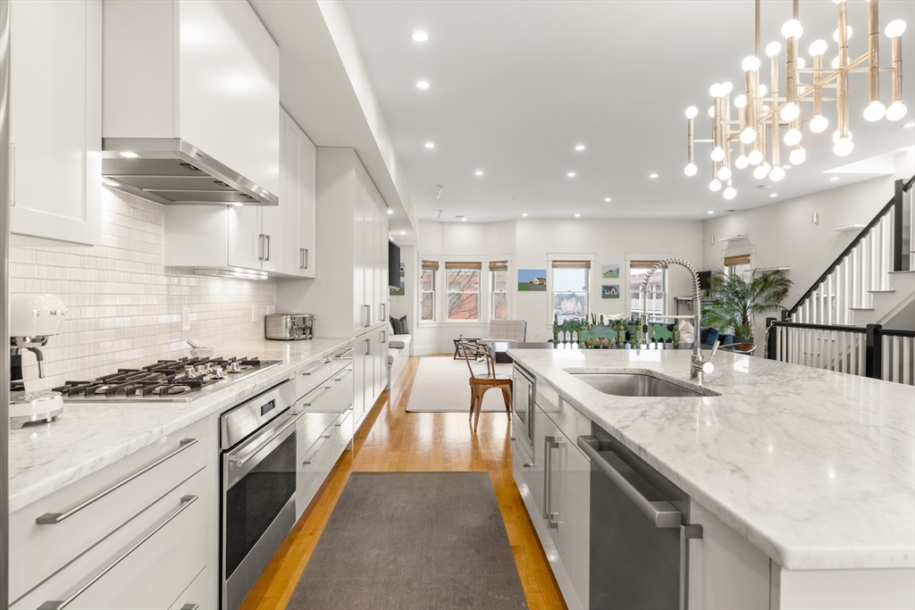 138 West 3rd Street Boston, MA 02127 - Photo 1 of 21 a large kitchen with stainless steel appliances granite countertop a lot of counter space