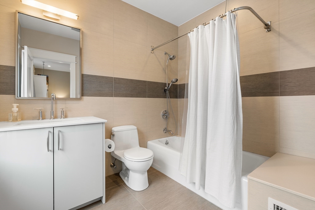 138 West 3rd Street Boston, MA 02127 - Photo 12 of 21 a bathroom with a toilet sink and shower