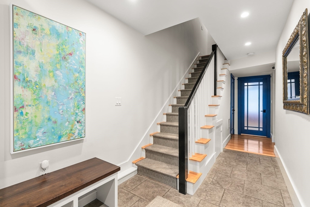 138 West 3rd Street Boston, MA 02127 - Photo 16 of 21 a view of a hallway with wooden floor and staircase
