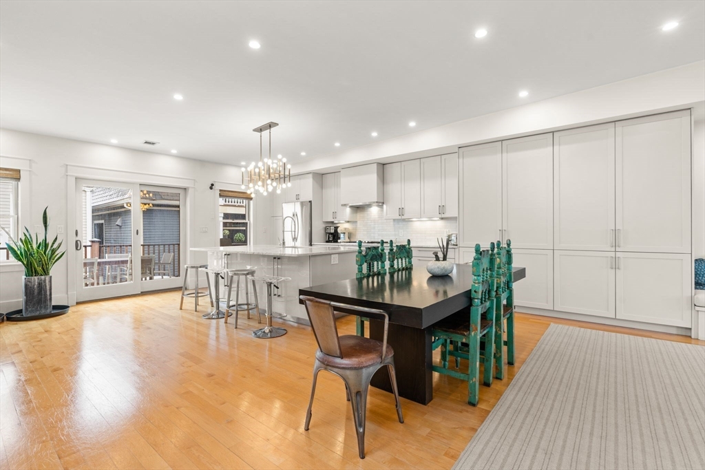 138 West 3rd Street Boston, MA 02127 - Photo 4 of 21 a dining room with furniture and wooden floor