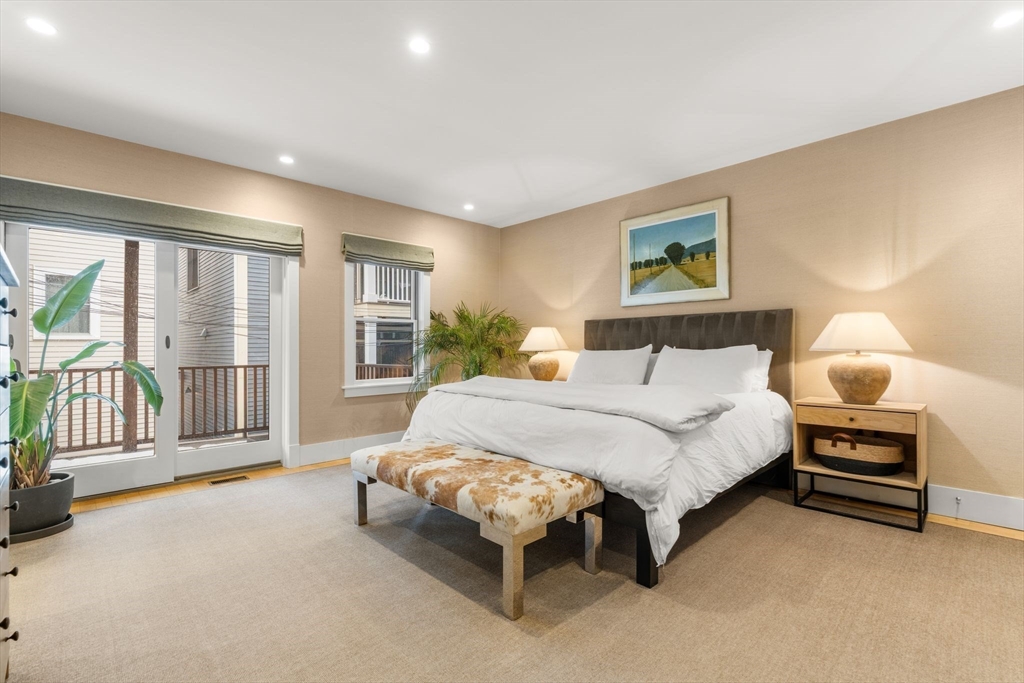 138 West 3rd Street Boston, MA 02127 - Photo 8 of 21 a spacious bedroom with a bed and a couch