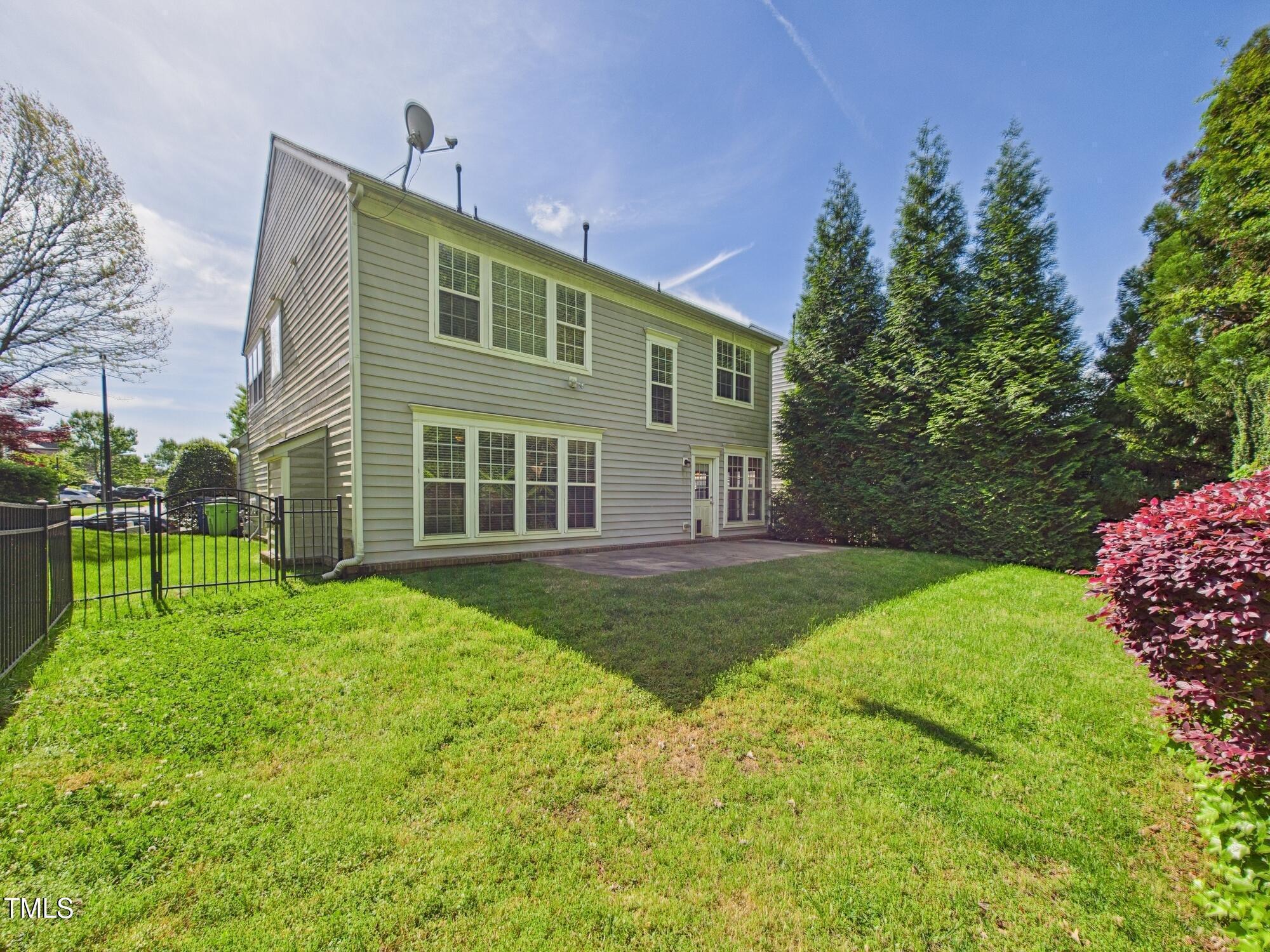 12589 Honeychurch Street Raleigh, NC 27614 - Photo 27 of 100 a view of a house with backyard and a garden