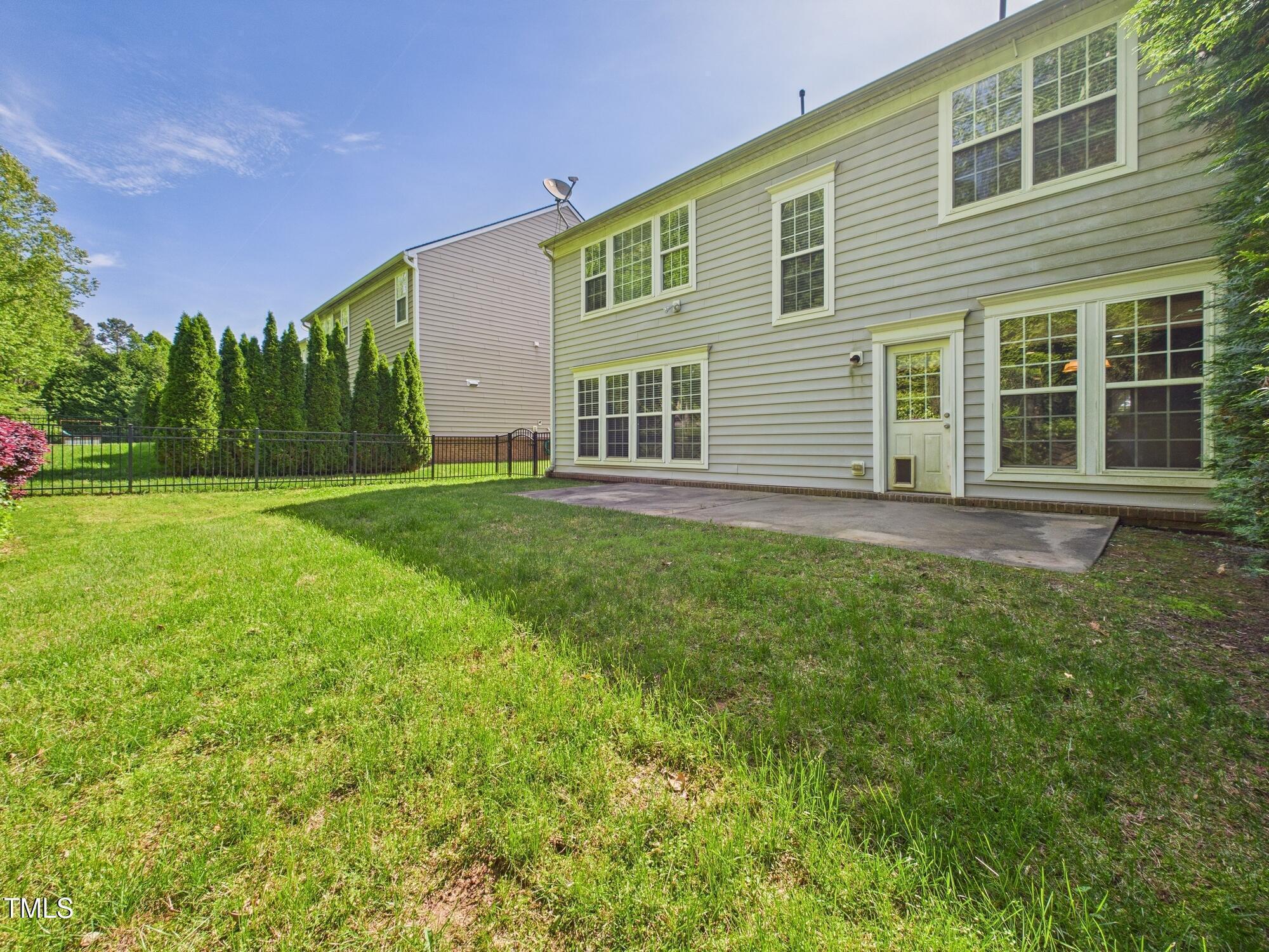12589 Honeychurch Street Raleigh, NC 27614 - Photo 29 of 100 a view of a house with backyard and garden