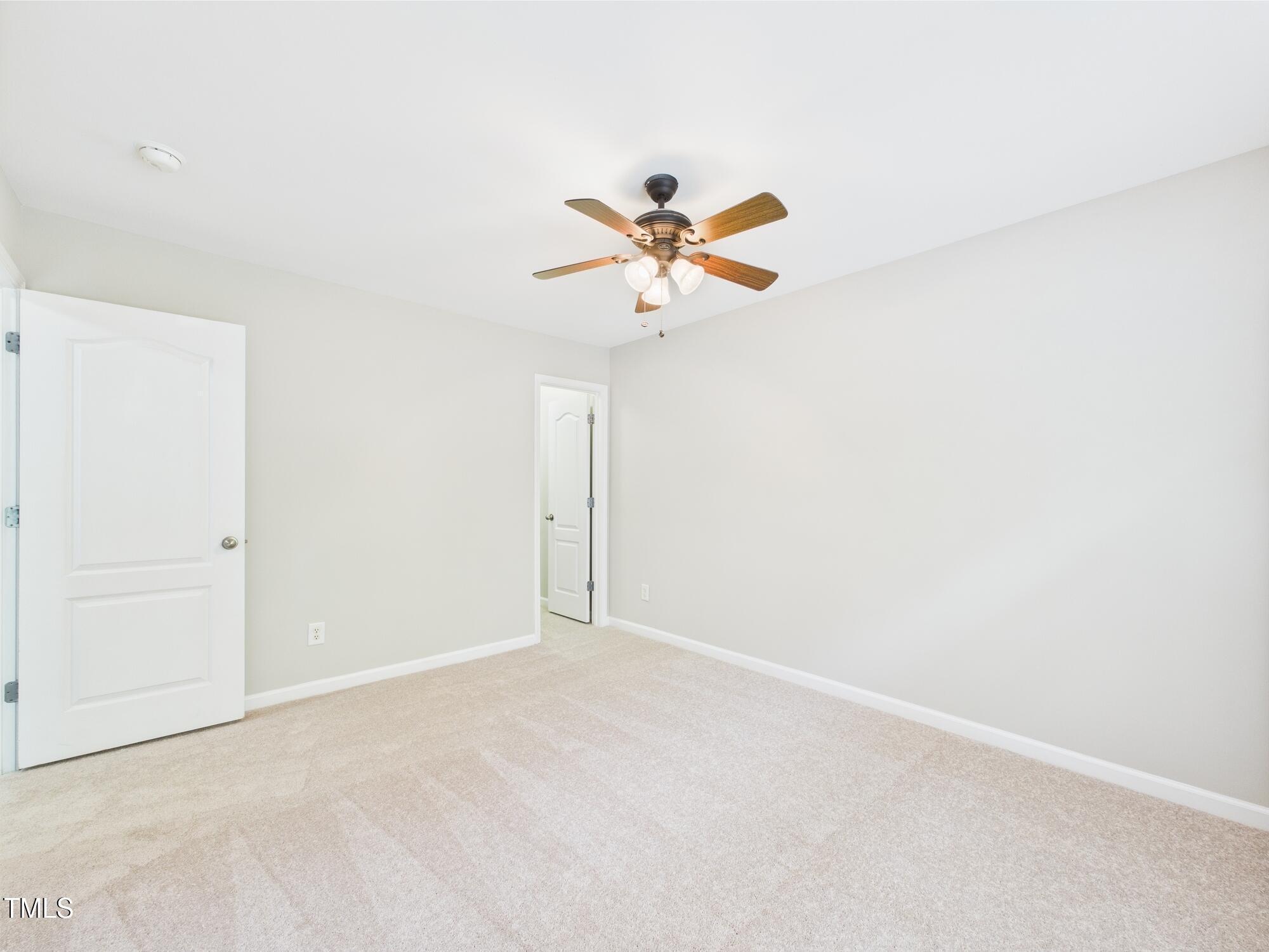 12589 Honeychurch Street Raleigh, NC 27614 - Photo 48 of 100 a view of a room with a ceiling fan and a chandelier fan
