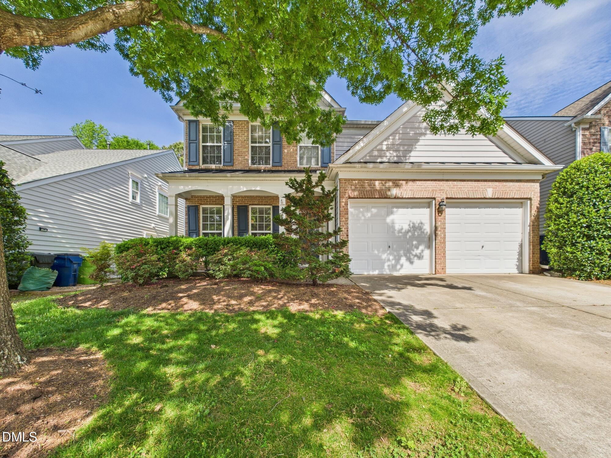 12589 Honeychurch Street Raleigh, NC 27614 - Photo 51 of 100 front view of a house with a yard