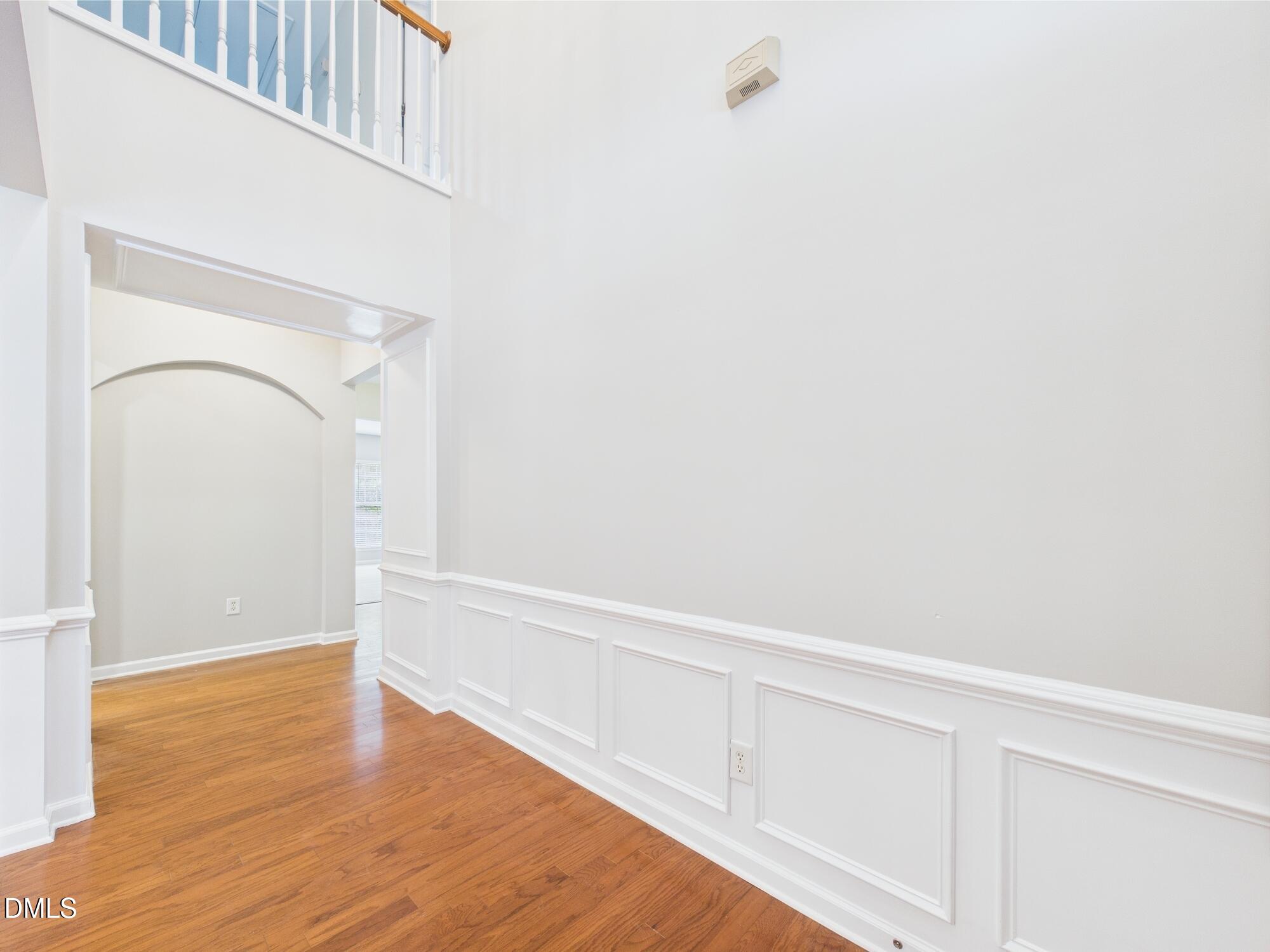 12589 Honeychurch Street Raleigh, NC 27614 - Photo 61 of 100 a view of an empty room with wooden floor