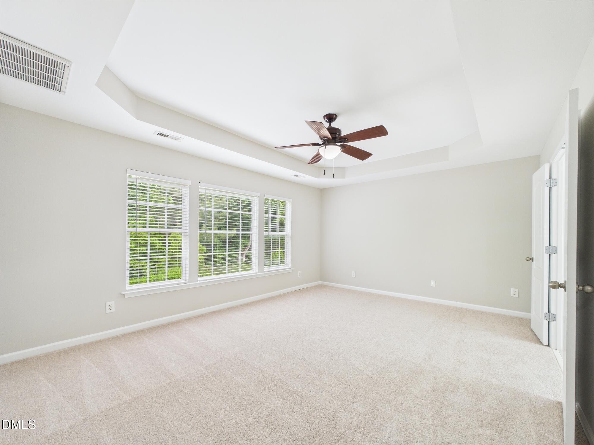 12589 Honeychurch Street Raleigh, NC 27614 - Photo 87 of 100 a view of an empty room with a window