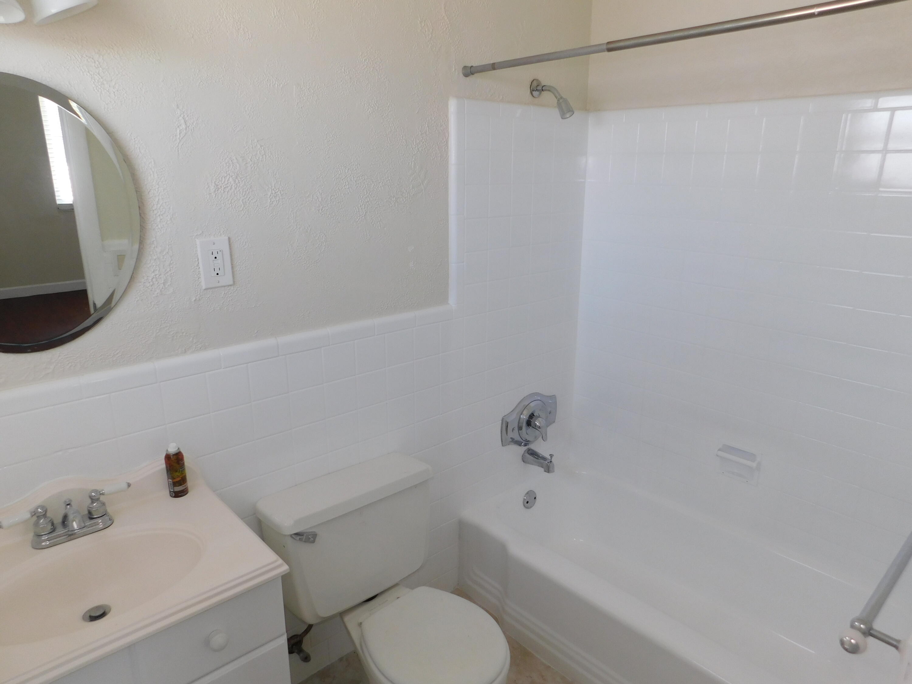 741 Hummingbird Way, Unit 4 North Palm Beach, FL 33408 - Photo 13 of 19 a bathroom with a sink toilet and shower