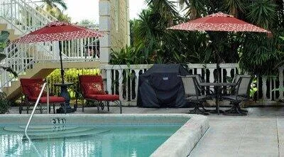 an outdoor space with patio and umbrella