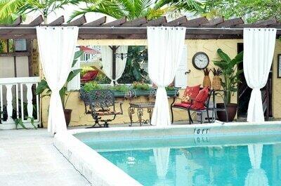 741 Hummingbird Way, Unit 4 North Palm Beach, FL 33408 - Photo 16 of 19 swimming pool view with a outdoor seating space