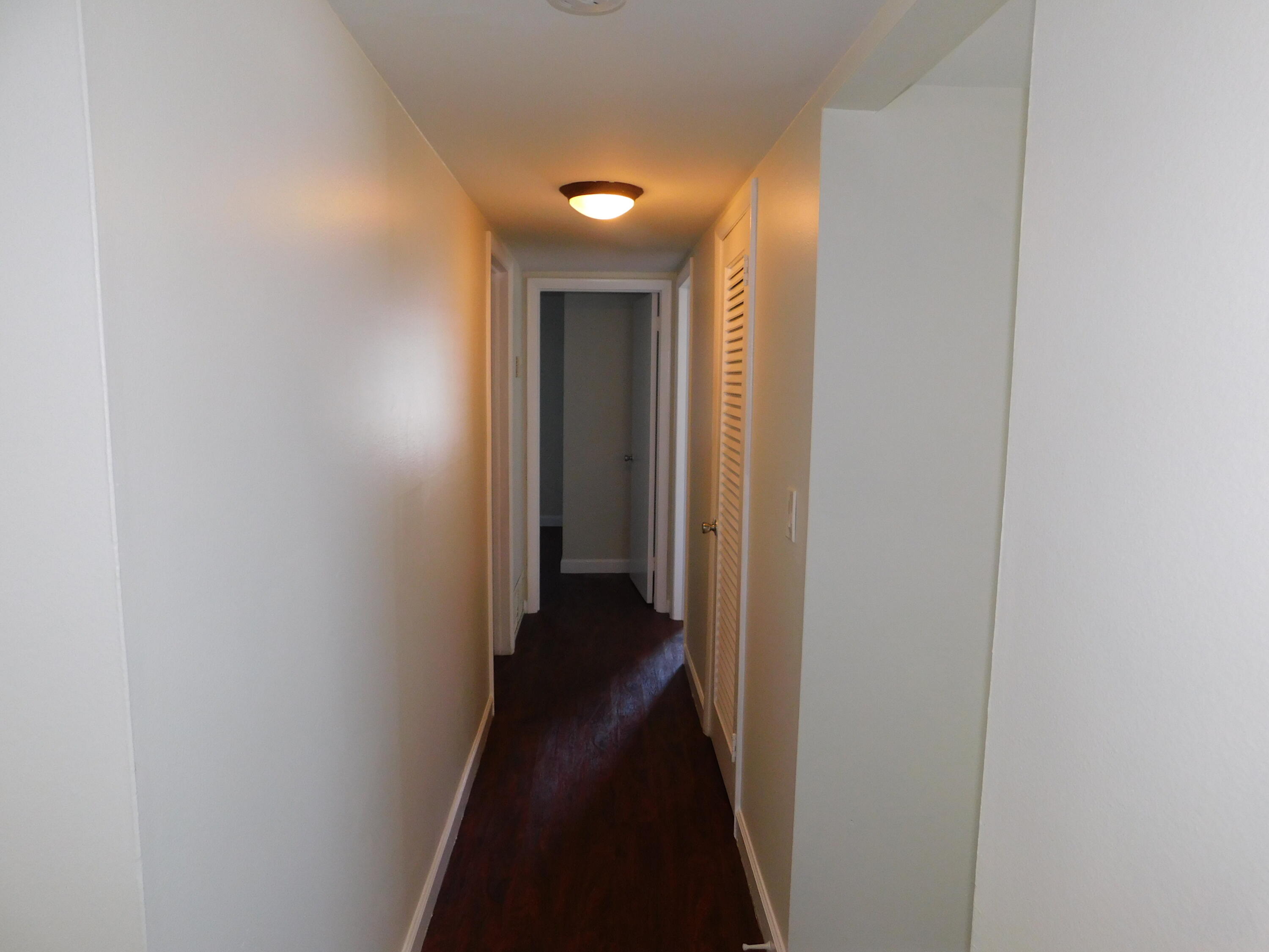 741 Hummingbird Way, Unit 4 North Palm Beach, FL 33408 - Photo 8 of 19 a view of a hallway with a hallway