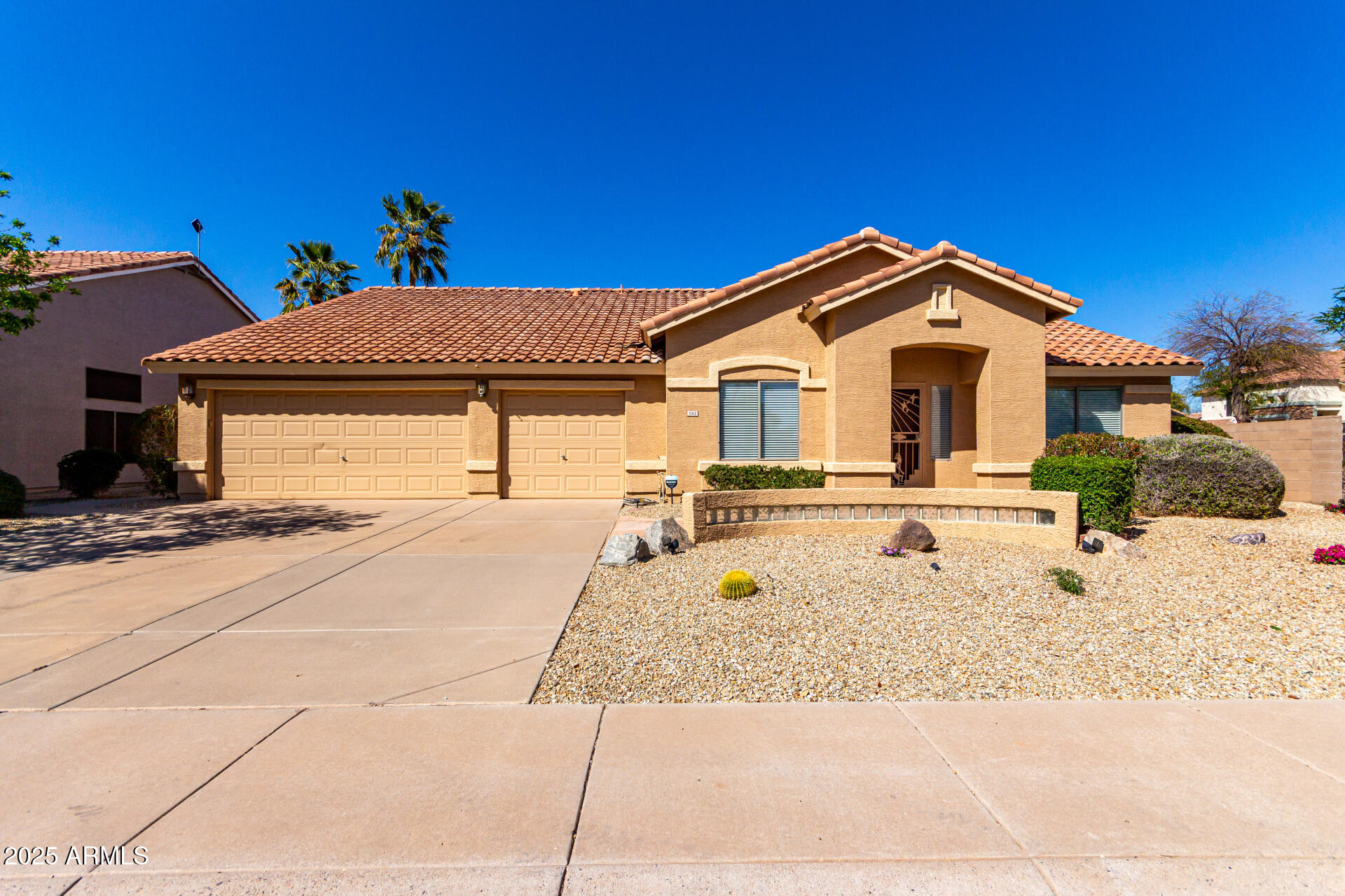 1182 East Harrison Street Gilbert, AZ 85295 - Photo 1 of 23 a front view of a house with a yard