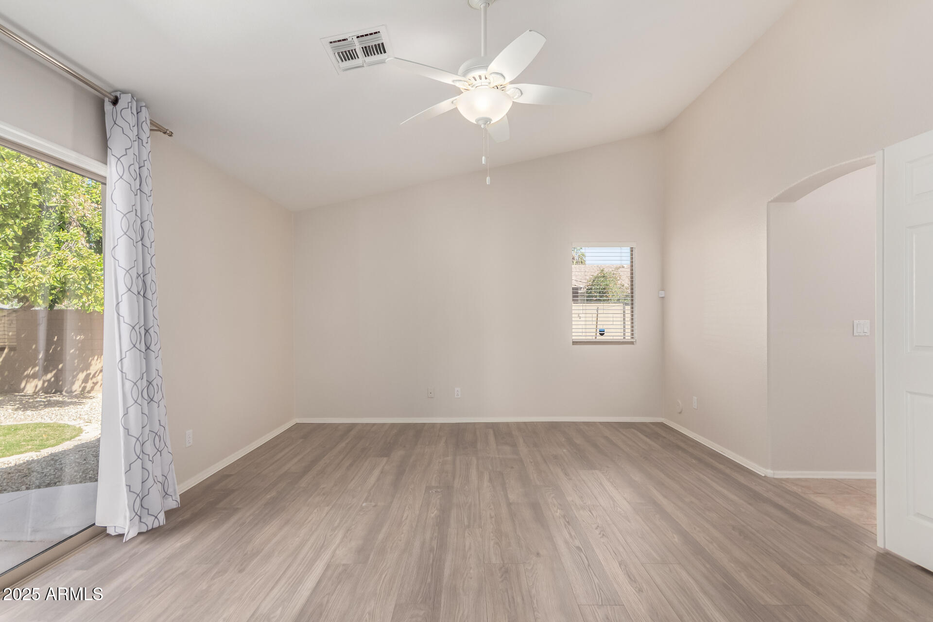 1182 East Harrison Street Gilbert, AZ 85295 - Photo 12 of 21 wooden floor in an empty room with a window