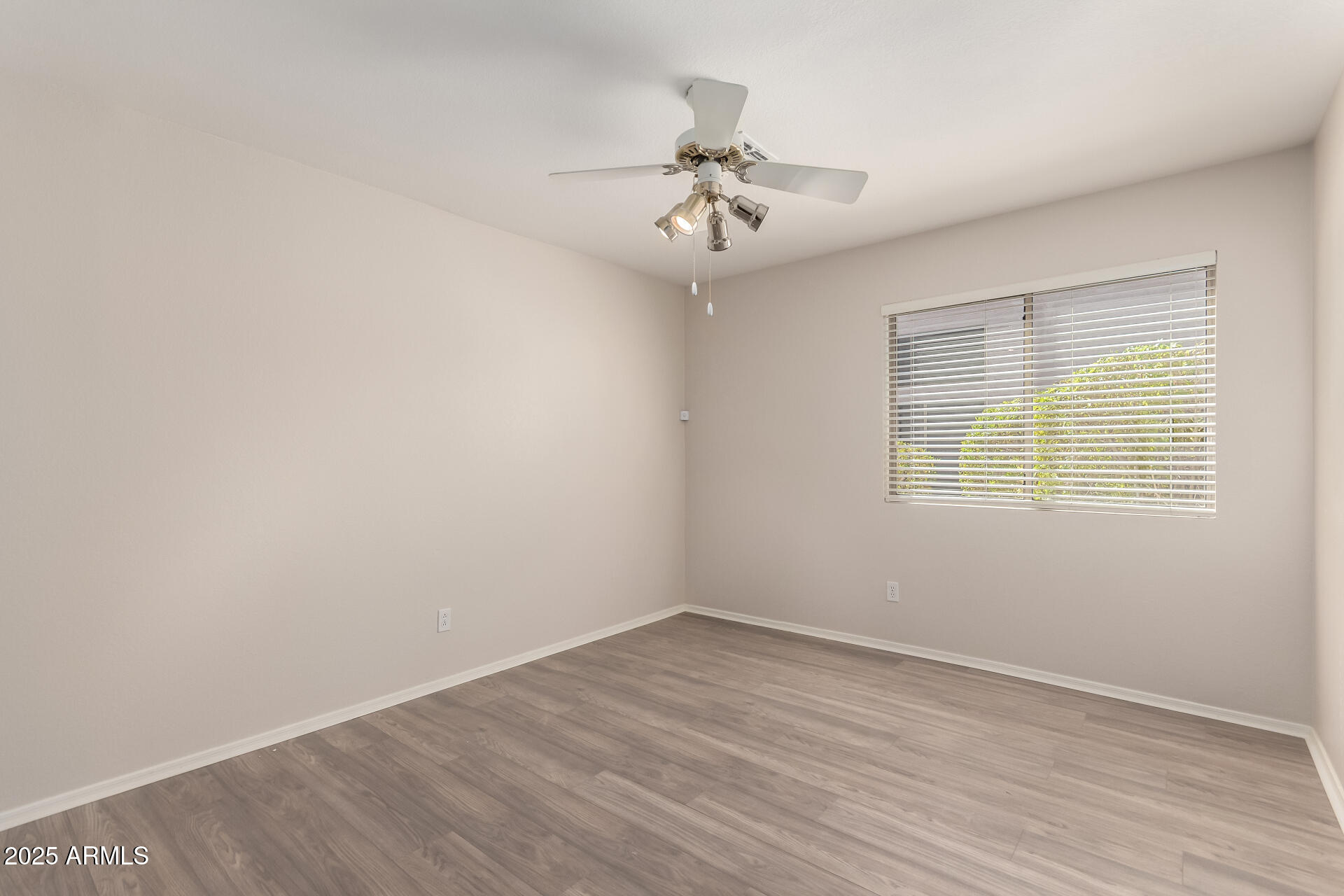 1182 East Harrison Street Gilbert, AZ 85295 - Photo 16 of 23 wooden floor in an empty room with a window