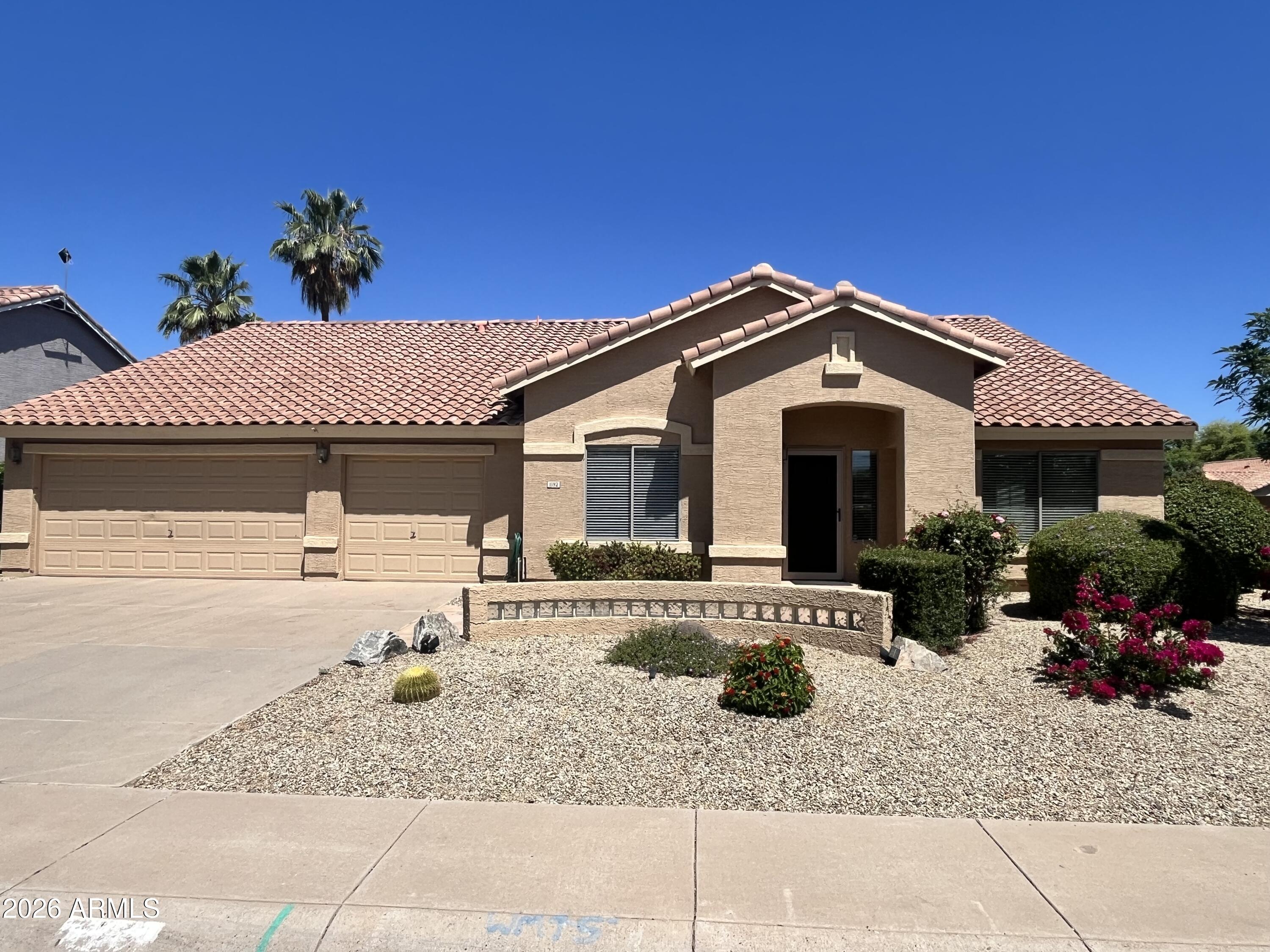 1182 East Harrison Street Gilbert, AZ 85295 - Photo 2 of 21 a front view of a house with a patio