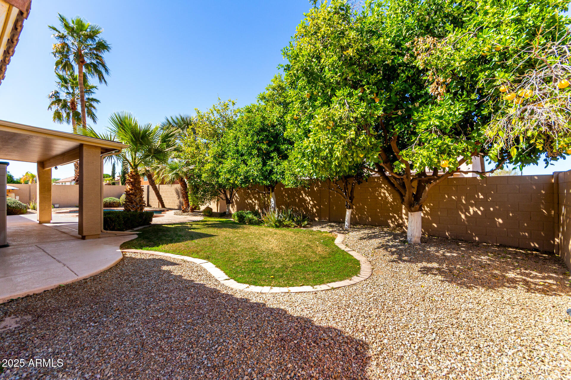 1182 East Harrison Street Gilbert, AZ 85295 - Photo 21 of 23 a view of a swimming pool with a patio