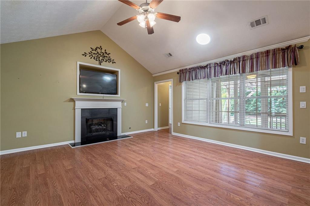 245 Memory Lane Winder, GA 30680 - Photo 8 of 62 a view of livingroom with window fireplace and ceiling fan