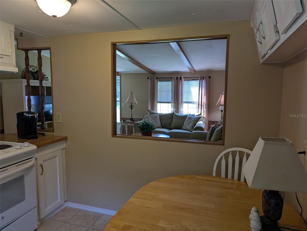 56314 Blue Creek Road Astor, FL 32102 - Photo 12 of 23 a bedroom with a bed and dresser