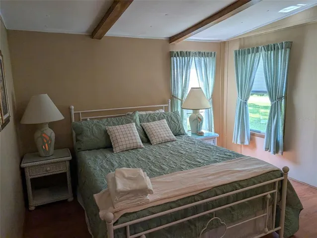 a bedroom with a bed and window