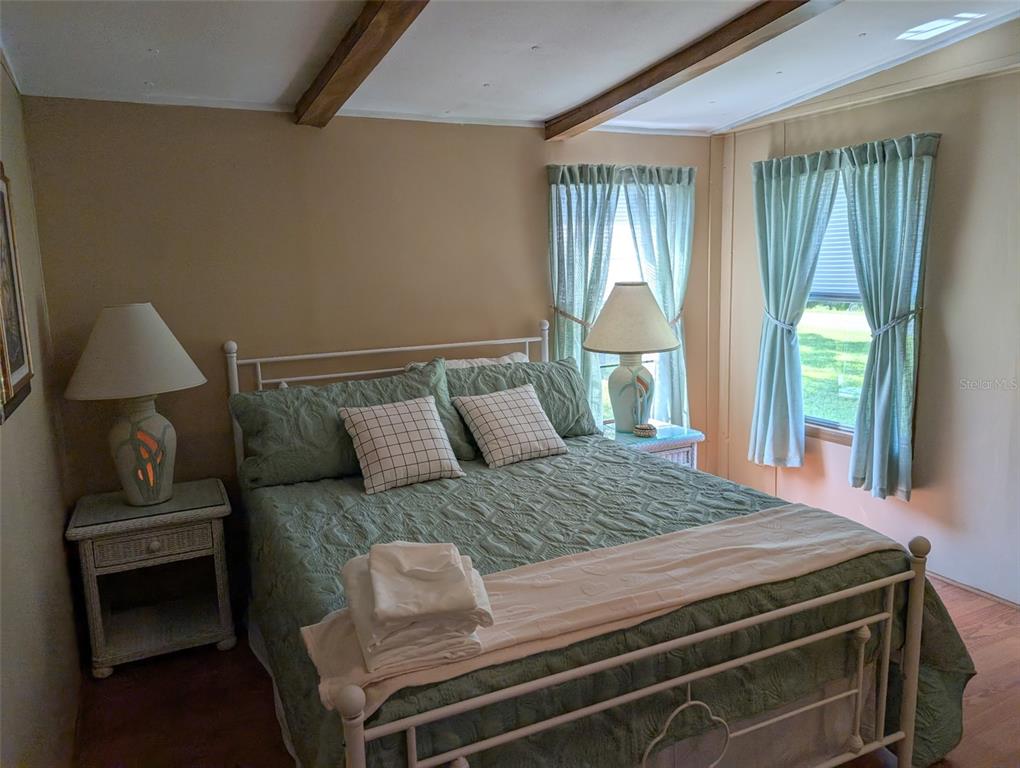 56314 Blue Creek Road Astor, FL 32102 - Photo 15 of 23 a bedroom with a bed and window