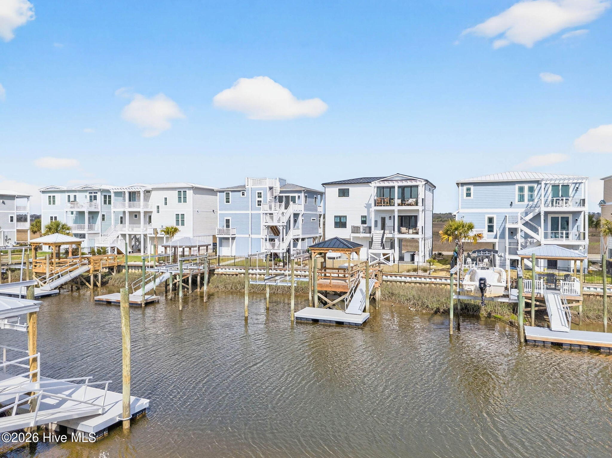 1416 Riverside Drive Sunset Beach, NC 28468 - Photo 77 of 83 Aerial canal view highlighting private dock, waterfront access, and connection to the Intracoastal Waterway.