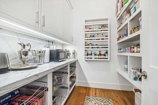 a kitchen with appliances cabinets and a counter top space