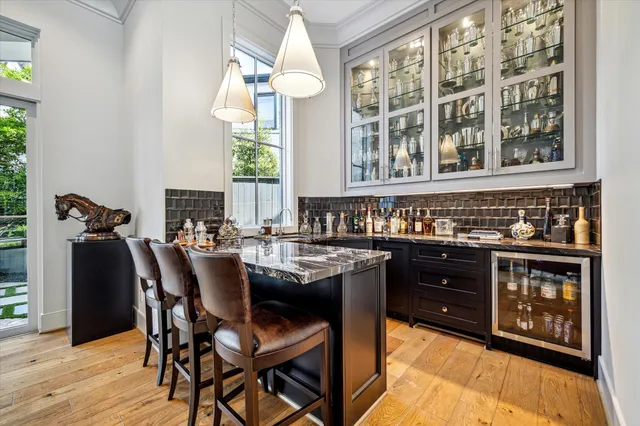 a dining table with chairs and wooden floor