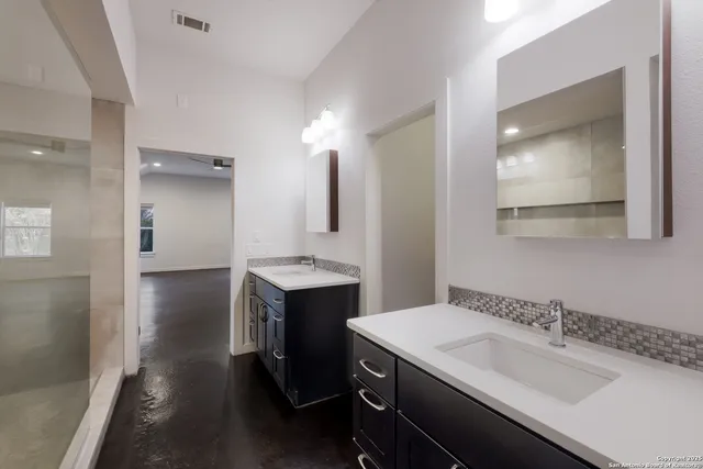a bathroom with a sink and a mirror