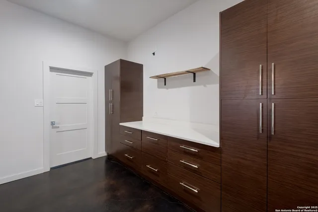 a bathroom with a shower and a sink