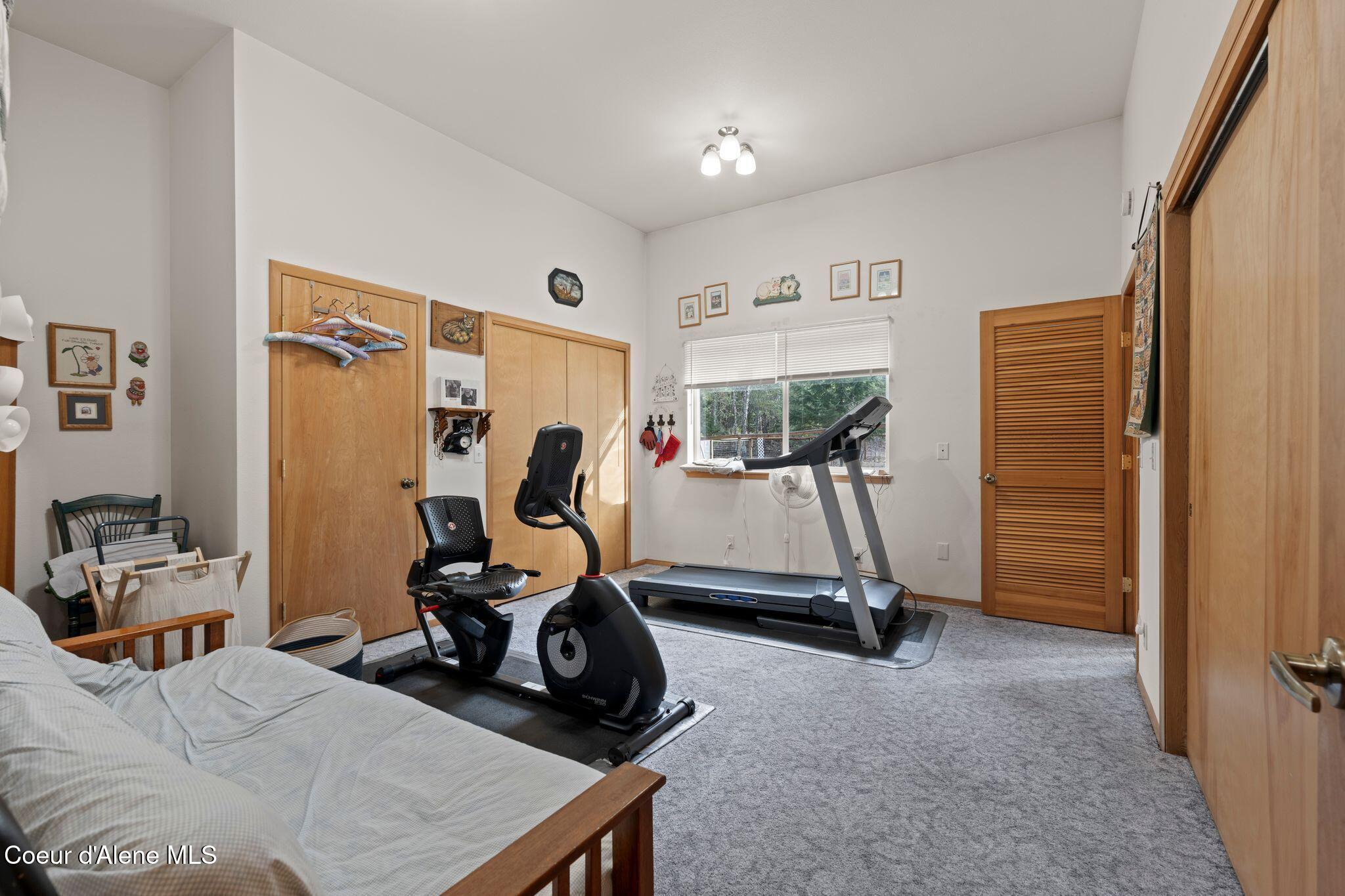 780 Selkirk Road Sandpoint, ID 83864 - Photo 12 of 57 Main level bedroom with laundry area