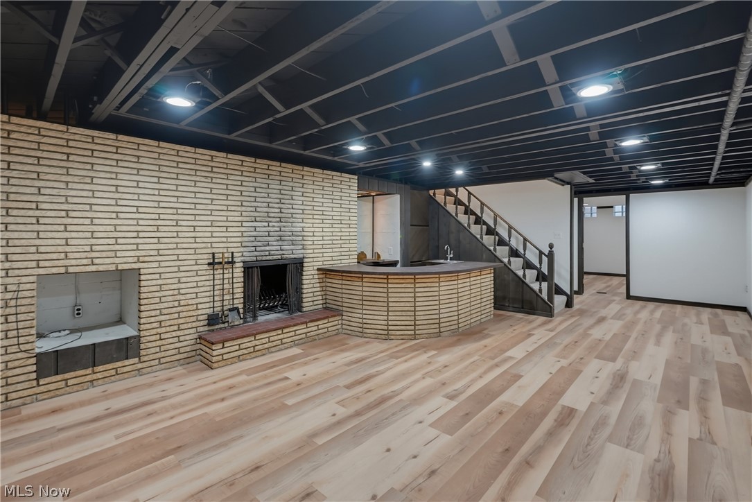 6125 Hillside Road Independence, OH 44131 - Photo 37 of 50 Recroom with wood burning fireplace and wet bar